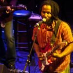 Ziggy Alberts performing live at an outdoor music venue in Australia