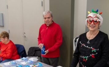 children receiving Christmas toys at community event