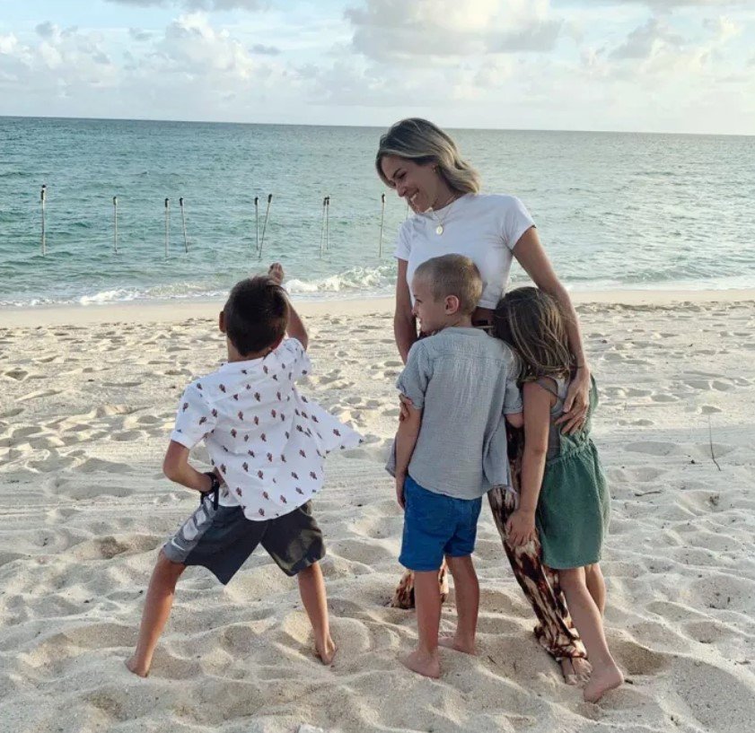 kristin cavallari and children hugging outdoors